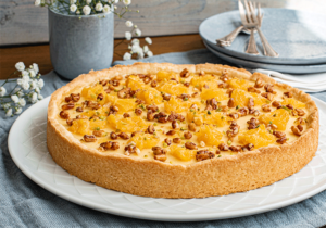 Ricottakuchen mit Pinienkernen und Orangen